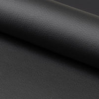 Dettaglio del rivestimento in ecopelle nera della sedia Arosa, texture elegante e resistente per un design raffinato.